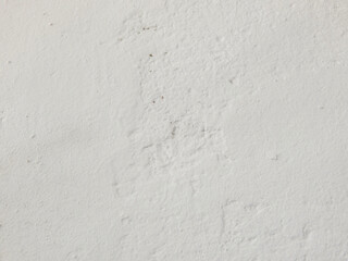 Texture of a white wall plaster as background with copy space