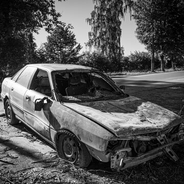 Abandoned broken car on the road