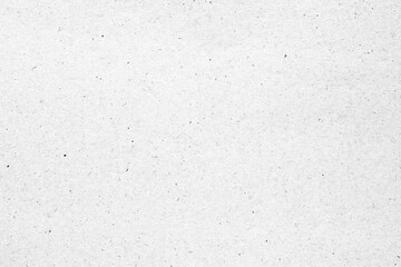 White paper or cardboard texture with black spot background.