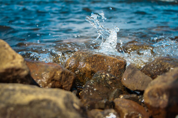 Sea, coast, stone Beach, water splashes Cool summer day
