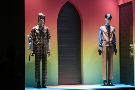 Milan, Italy - January 13, 2020: Gucci outfits in a rainbow colored showcase