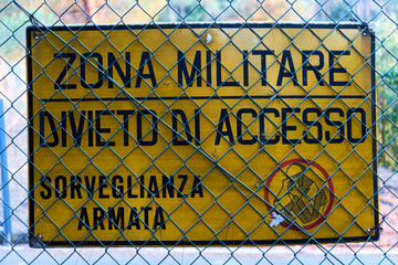 sign prohibiting access to the military zone