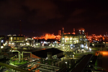 Fototapeta premium The light of a petrochemical factory that is normally produced on nights with full stars.
