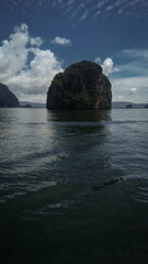 
View of beautiful mountain and blue sky during a relaxing afternoon over the calm sea on a boat in Phang Nga Island, Thailand. Summer Holidays in Asia. 