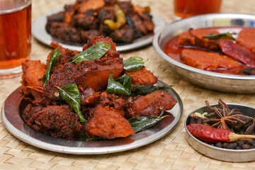 Fried chicken Kebab, Kerala Chicken fry or 65 is hot and spicy crispy chicken dish South India. Non vegetarian starter or quick snack. A popular authentic roasted dish deep fried Indian spices. 
