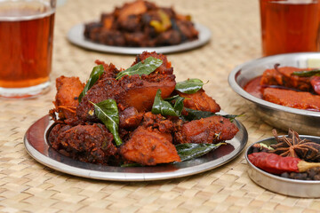 Fried chicken Kebab, Kerala Chicken fry or 65 is hot and spicy crispy chicken dish South India. Non vegetarian starter or quick snack. A popular authentic roasted dish deep fried Indian spices. 