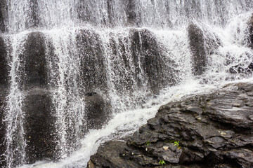 Waterfall cascades on the rocks. 