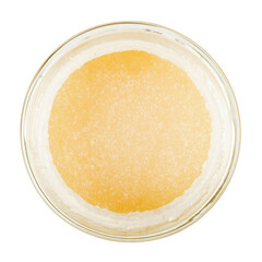 Meadow honey in a glass jar. Isolated on a white background. View from the top.