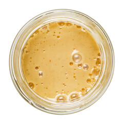 Fototapeta na wymiar Honey with pollen in a glass jar. Isolated on a white background. View from the top.