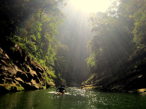 Bandarban, Bangladesh-January 7, 2015: The adventure of searching a waterfall by using bamboo made boat. The very remote area of Bandarban, Bangladesh. The trailing from shat vai Khum to Amia Khum.