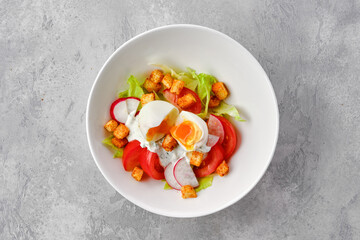Salad with tomato, radish, egg and crouton