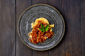 Goulash with millet porridge and creamy sauce