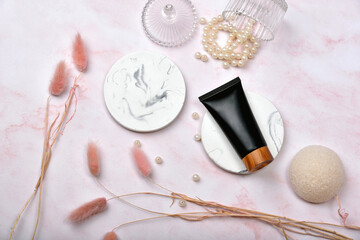 Cosmetic bottle containers on pink marble background, Blank label package for branding mock-up, Natural organic beauty product concept, Research and development of purified skincare.