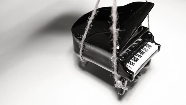 footage of black piano rope white background 