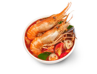 Thai food Tom Yum Kung.Thai hot and spicy soup shrimp in bowl.with Straw Mushroom,lime,Kaffir lime leaves,tomato and chilli. Splash on the air. isolated on white background.