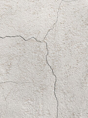 Obraz premium The texture of the old cracked wall. Cracks in the plaster. Background of textured old wall with cracks.