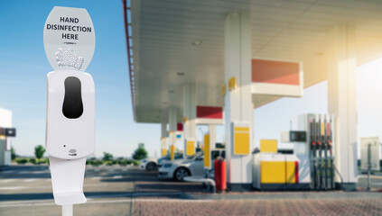 Contactless disinfection for hands on a gas station during the coronavirus pandemic