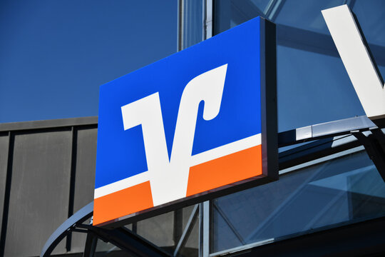 Sehnde, Lower Saxony / Germany - May 21, 2018: Sign with the logo of the german credit union Volksbank - Raiffeisenbank in Sehnde, Germany