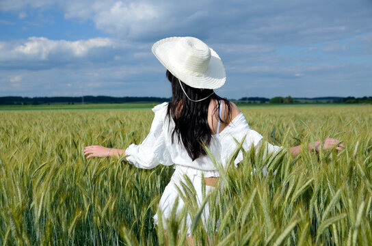 Beautiful country girl in barley field
