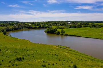 A lake on the edge of a typical European village.