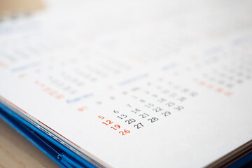 Obraz premium Close up calendar page dates abstract blurred background business planning appointment meeting concept
