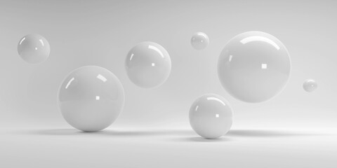 3d rendering of several sized reflected spheres inside a white studio