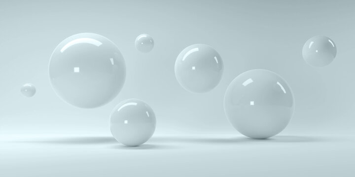 3d rendering of several sized reflected spheres inside a blue studio