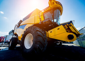 Modern agricultural machinery and equipment. Yellow agricultural harvester.