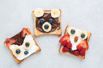 Funny Healthy Breakfast Toasts For Kids Shaped As Cute Animals On Grey Concrete Background. Children's Food Menu For School Lunch Box Or Breakfast At Home. Motherhood Concept