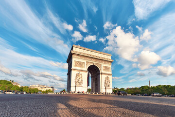 Fototapeta na wymiar Arc de Triumph in Paris, France, on an empty square with feather clouds in blue sky above, panorama