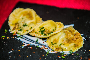 Stuffed potato dumplings with herb. The food in the restaurant. Food styling and restaurant meal serving. 