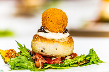 Fried meatball with herb sauce and potato on plate. The food in the restaurant. Food styling and restaurant meal serving. 