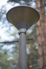 Triangular lantern on a gray pillar.