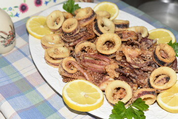Fried Squid Rings With Lemon in the Plate