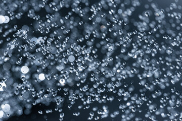 Naklejka na ściany i meble Falling water drops - rain in macro detail