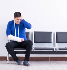 Desperate man waiting for his appointment in hospital with broke