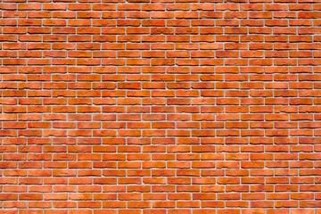 Wall of red brick. Designer interior background. Abstract architectural surface.