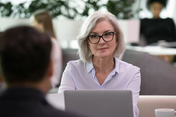 Experienced human resources manager listening vacancy candidate during job interview. Female hr or...