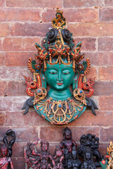Hindu mask and figurines displayed for sale near Durbar Square, Bhaktapur, Nepal