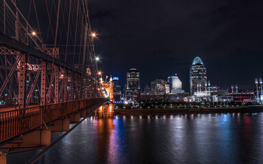 Fototapeta na wymiar City Skyline at Night by Bridge
