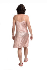 rear view of a woman with nightgown walking on white background,