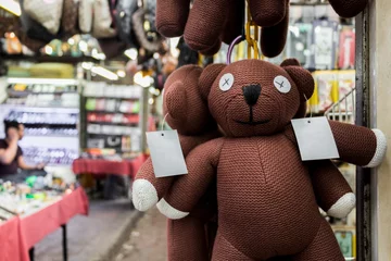 Tuinposter Fake Mr. Bean teddy bear in the market, Kuala Lumpur. © arkadijschell