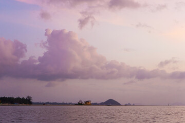 Burning bright sky during sunset on a tropical beach. Sunset during the exodus, the strength of...