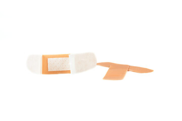 Adhesive plaster isolated on white background. Healing wounds, scratches, sadin.
