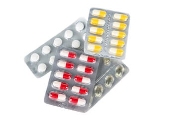 pills isolated on white background.Concept of treatment.Vitamins, pills.Pack packs for colds.