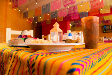 MEXICAN FOOD, CHILLI STUFFED WITH CHEESE WITH RICE AND REFRITED BEANS IN A MEXICAN RESTAURANT