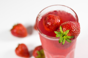 Fresh strawberry cocktail. Fresh fruit summer lemonade with strawberries and ice cubes.