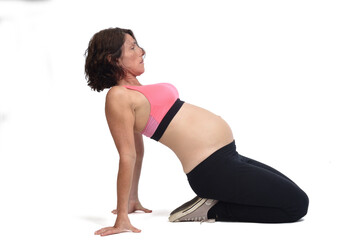 Fototapeta premium pregnant woman doing floor exercises on white background