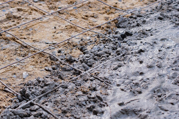 Concrete that is pouring the pavement while working.