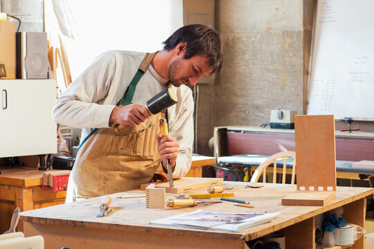 male woodworker in his woodworking shop